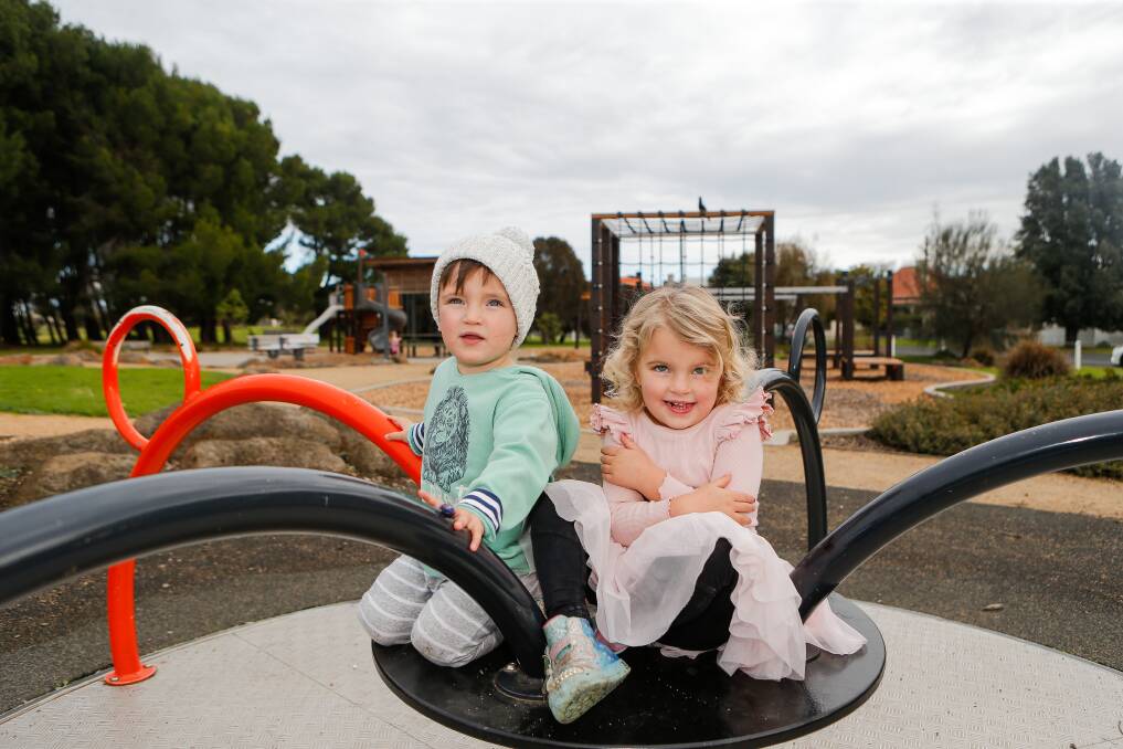 Playtime: Siblings River, 2, and Poppy, 4, Kelson are looking forward to both heading to kinder next year. Their parents have welcomed the state government's free kinder announcement this week. Picture: Anthony Brady