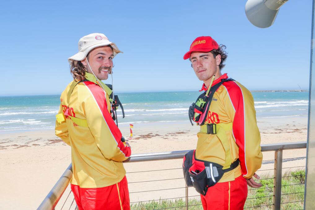 Professional lifeguards Sami Zehir and Will McNeil patrol Warrnambool's Lady Bay. Life Saving Victoria has issued a rough surf warning for the region's beaches on Tuesday. Picture by Anthony Brady