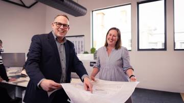 Warrnambool's Myers Planning & Associates managing director Steve Myers and senior planning consultant Amanda Power. The business is trialling a four-day work week with staff able to chose whether they work 32 hours over four days or five. Picture by Sean McKenna