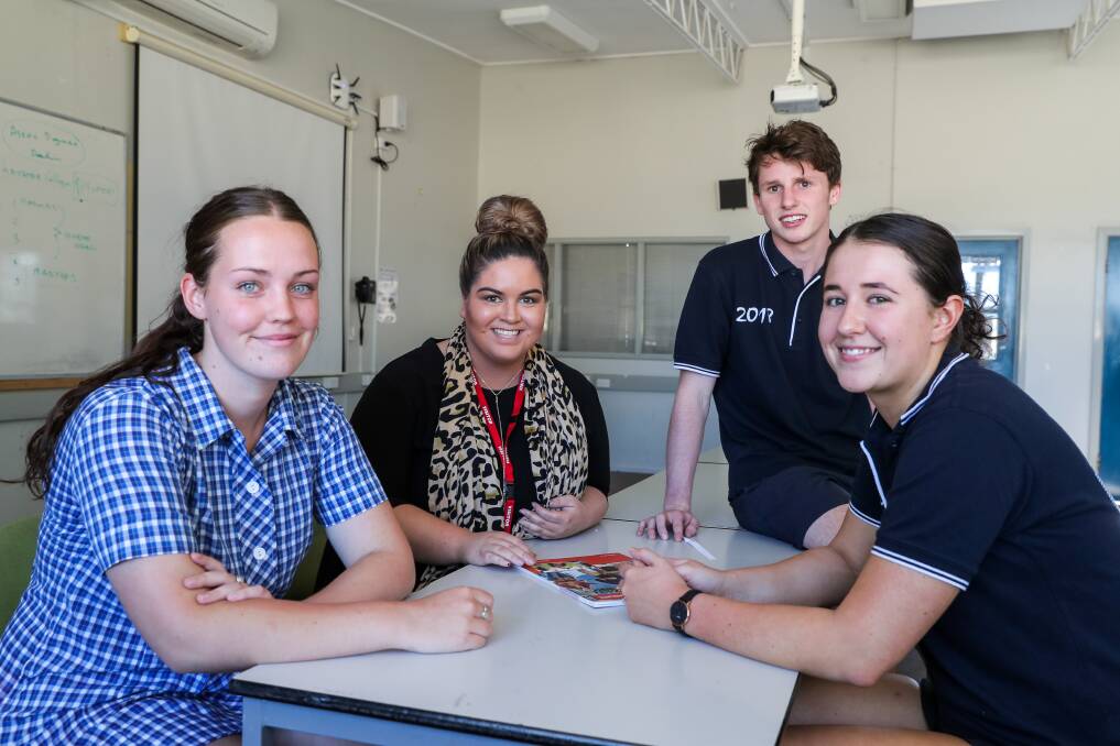 Experience: Warrnambool College year 12 students Isabel Wilkinson, 17, Matt Herrmann, 18, and Taylah Antonio, 17, discuss studying occupational therapy with school alumi and occupational therapist Danili Dwyer. Picture: Rob Gunstone

