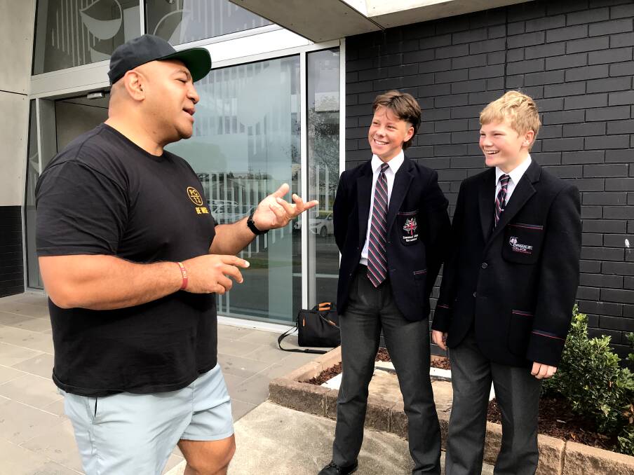 The Pat Cronin Foundation program facilitator Alan Latu with Emmanuel College students Rylee Parsons and Harry Van Rooy. 