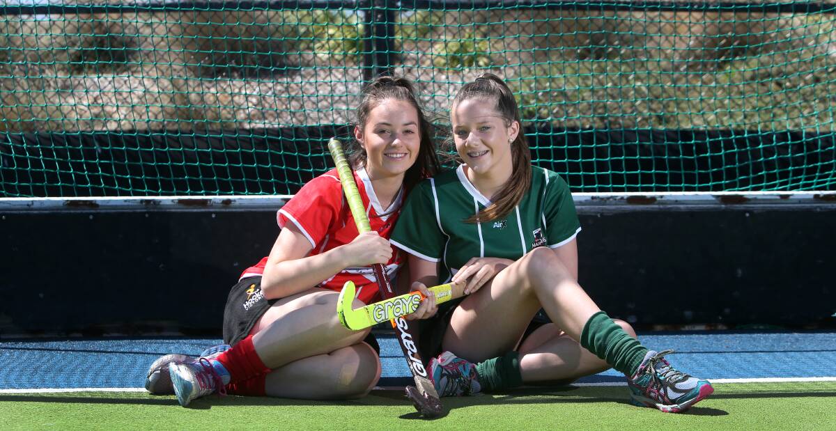 KEEPING Fit: Hockey players Bec Dyson, 15, and Kelsey Ratcliffe, 14, are in the minority of teenage girls who exercise regularly, a recent study says. Picture: Amy Paton