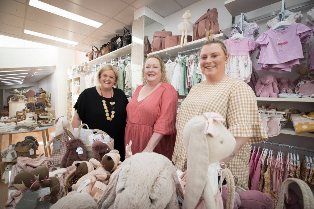 So Little Tiny has opened a new, larger store in Liebig Street. Pictured is manager Joanne Poyner, owner Michelle Barnard and sales assistant Eloise Craven. Picture by Sean McKenna