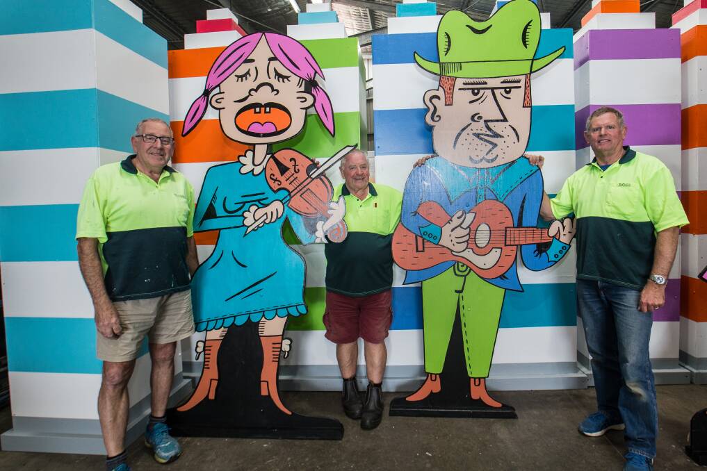 Colourful: Port Fairy Folk Festival volunteers Andrew Murrell, Neil Hedger and Ross Knudsen with the float they are entering in the Moyneyana Festival's New Year's Eve street parade. Picture: Christine Ansorge 