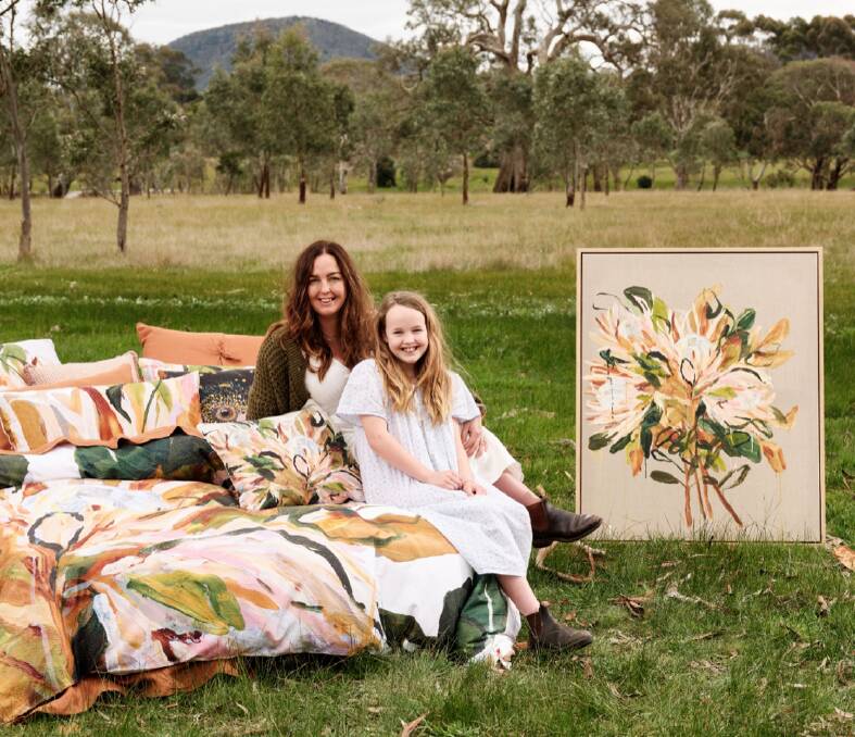 Hamilton artist Casey Manson with daughter Willow, 10 at the base of the mountains in Dunkeld. Casey's work has been chosen to feature in a national collaboration with Linen House to be sold at Myer stores and online. Picture by Lampoluce Photography