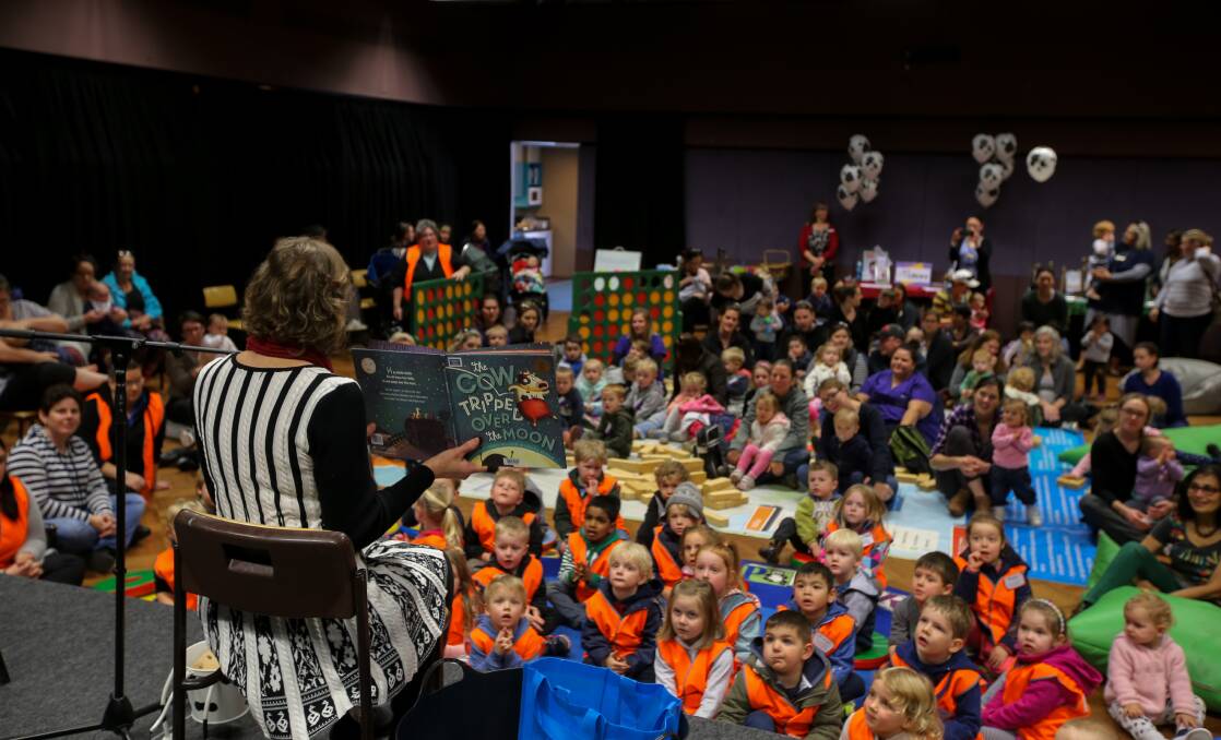 Tall tale: Warrnambool library officer Julie Struth reads The Cow Tripped Over The Moon at last year's National Simultaneous Storytime event. This year Hickory, Dickory Dash will be read at the Warrnambool library and to more than 680,000 Australian children. Picture: Rob Gunstone