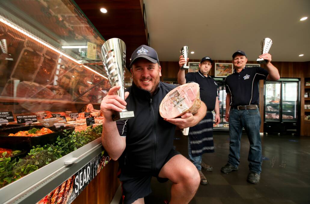Gold prize: Lucas Brothers Butchers owner Peter Harris with the award-winning Great Ocean Road Smallgoods ham on the bone, with smallgoods creator Lucas McFadyen and sausage maker Adam Bean. Picture: Chris Doheny