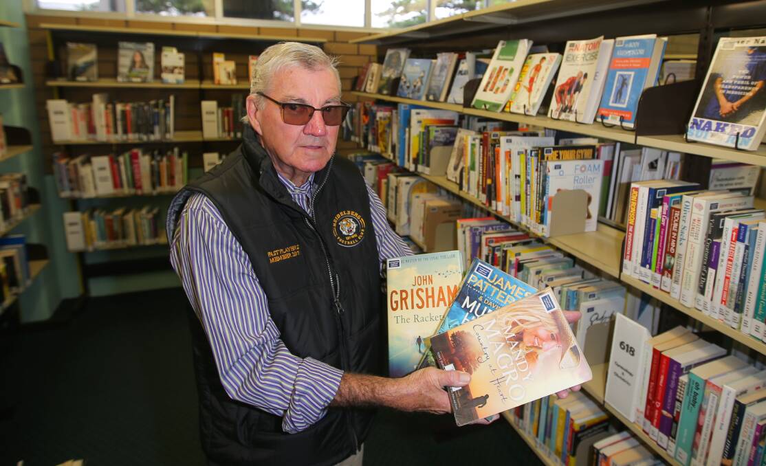 Book lover: Warrnambool's Brian McMahon with books by some of the most popular authors requested by library users. Picture: Morgan Hancock