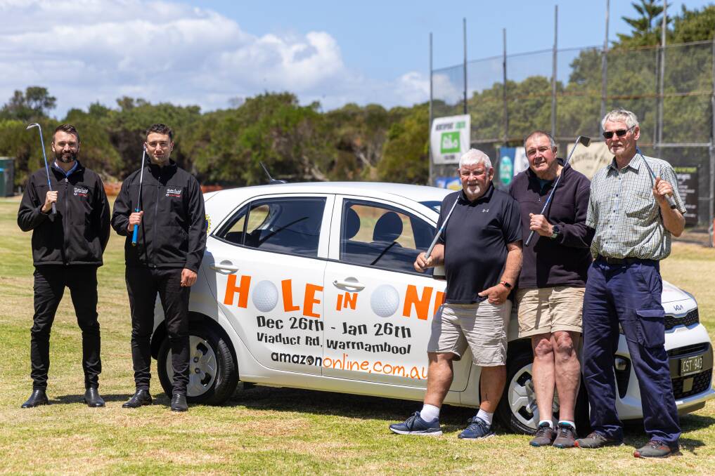 Clinton Baulch Motor Group's Ben Hogan and Dalton Barby with Warrnambool Rotary Club's Mike Toone, James Cowell and Peter Reeve at the hole-in-one competition. Picture by Eddie Guerrero