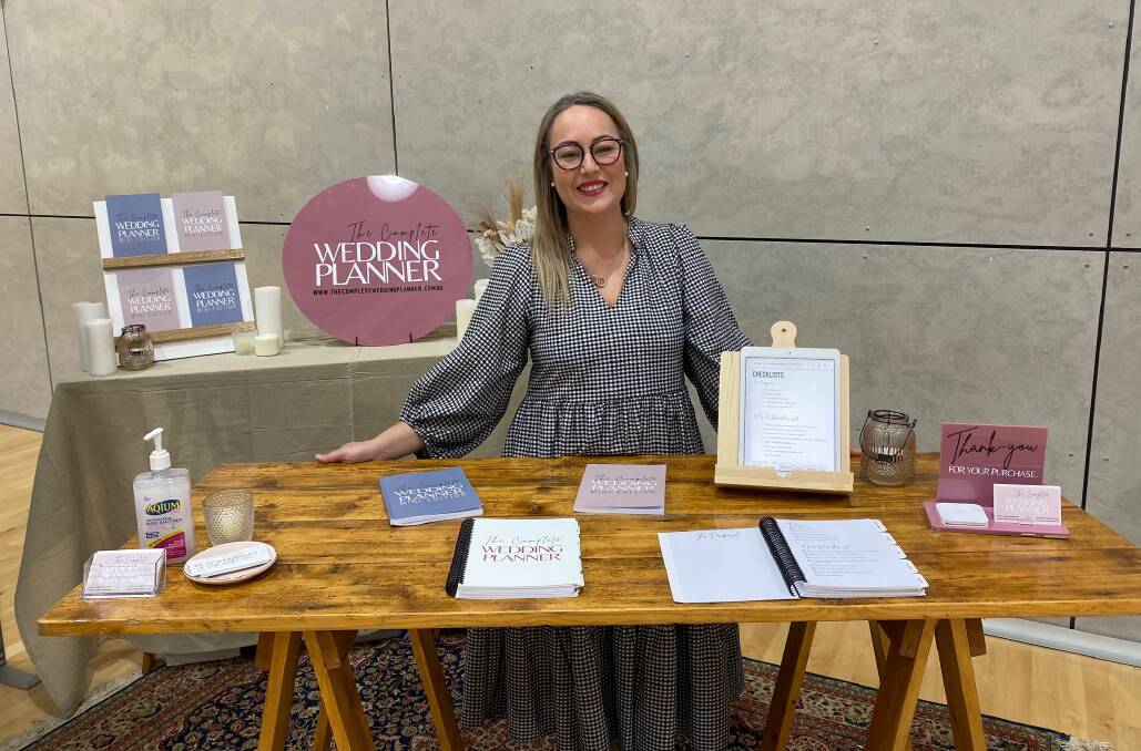 New resource: Warrnambool's The Complete Wedding Planner designer Sophie Peakin was at the expo with the guides she developed which feature south-west specific information. Picture: Madeleine McNeil