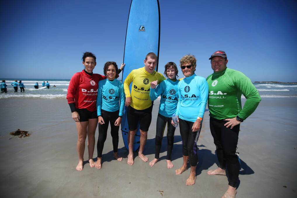 Riding high: Sarah Moncrieff, Charlie Moncrieff, participant Ryan Christie, Noah Ansell, Mary Page and Justin Houlihan at last year's disabled surfing event.