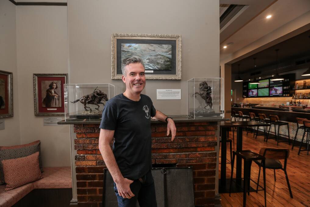 History: Publican Lucas Reid with the Jericho Cup display at The Cally hotel. Picture: Christine Ansorge
