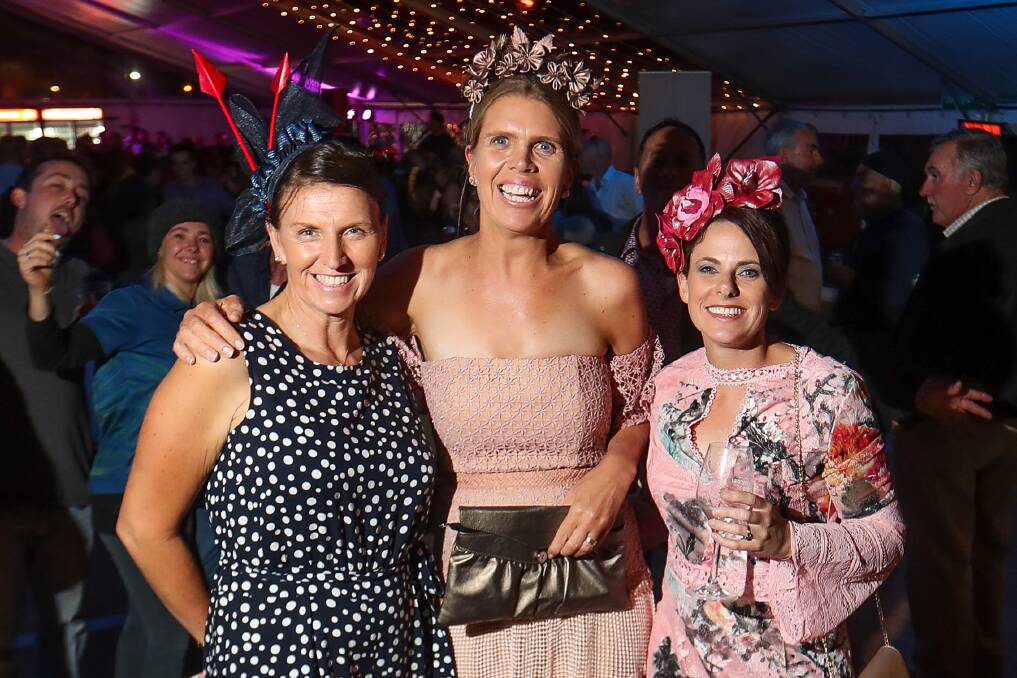 Friends: Local residents Daphne Ginley, Penny Walsh and Sally Conheady were among the racegoers who continued their carnival celebrations in The Cally marquee on Tuesday night. Picture: Morgan Hancock