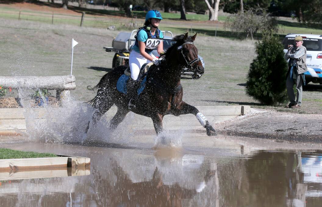 Go: Competitor Alice Embry, on Spanner Collusion, negotiates the water at the Camperdown Horse Trials. It's on Saturday and Sunday at the Lakes Sporting Complex. Picture: Rob Gunstone

