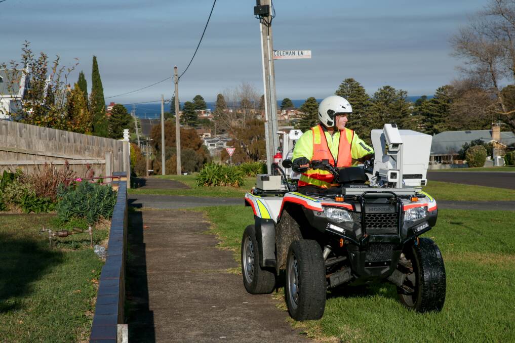 Slow and steady: All-terrain vehicles, equipped with cameras, are making their way around the city this month to assess the condition of all footpaths as part of a council audit. Kayla Suarez is operating one of five vehicles currently travelling along the city's paths. Picture: Chris Doheny