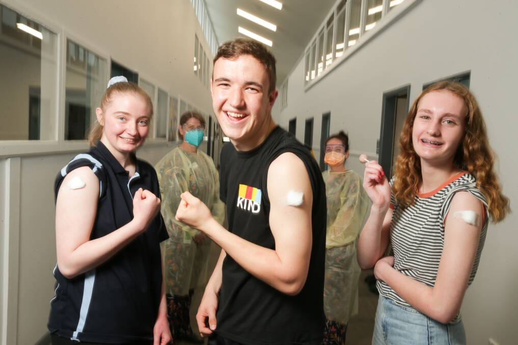Ready: Hawkesdale P-12 School students Olivia Smith, nurse Tracey Dean, Leigh Edwards, Tania Brown, nurse Tania Brown and Alex Lewis receive a Pfizer vaccine at school this month. Picture: Chris Doheny
