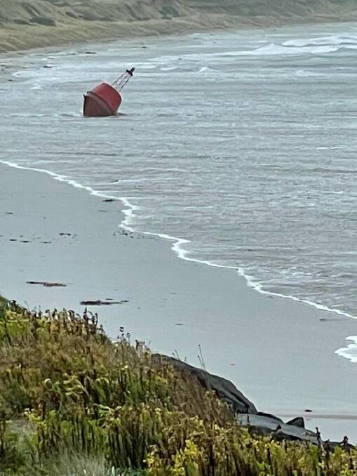 Beached: The large nunn buoy broke loose from its original position in Port Fairy Bay on Wednesday, coming to rest on East Beach. 