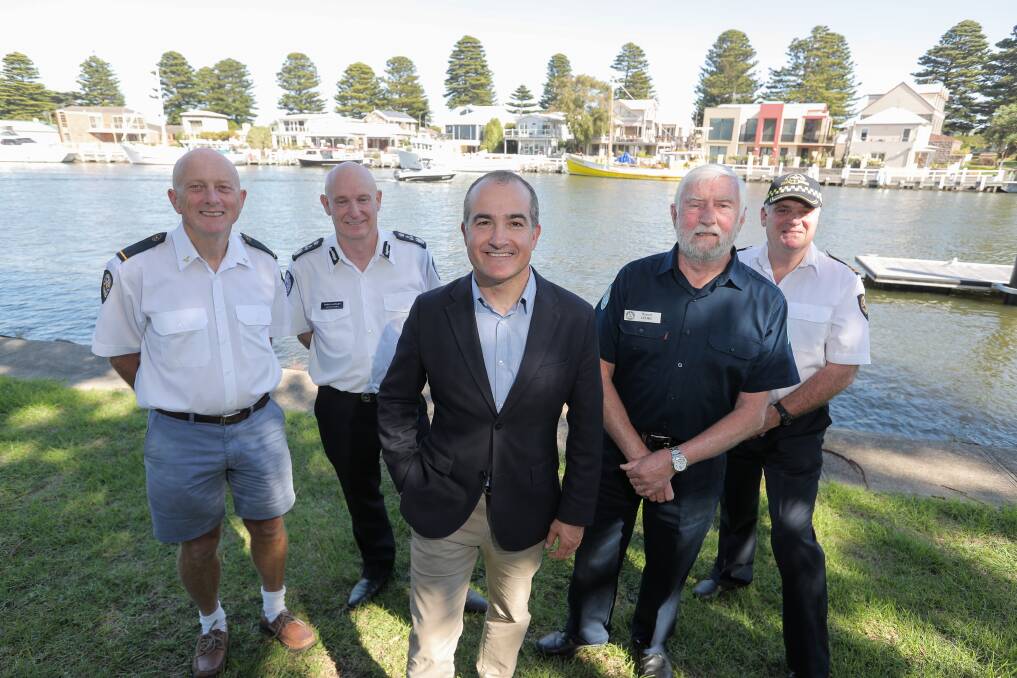 Warrnambool Coast Guard's Keith Prest, Emergency Management commissioner Craig Lapsley, Emergency Services Minister James Merlino, Port Fairy Marine Rescue's Russell Lemke and Portland Coast Guard's Peter Starick. Picture: Rob Gunstone