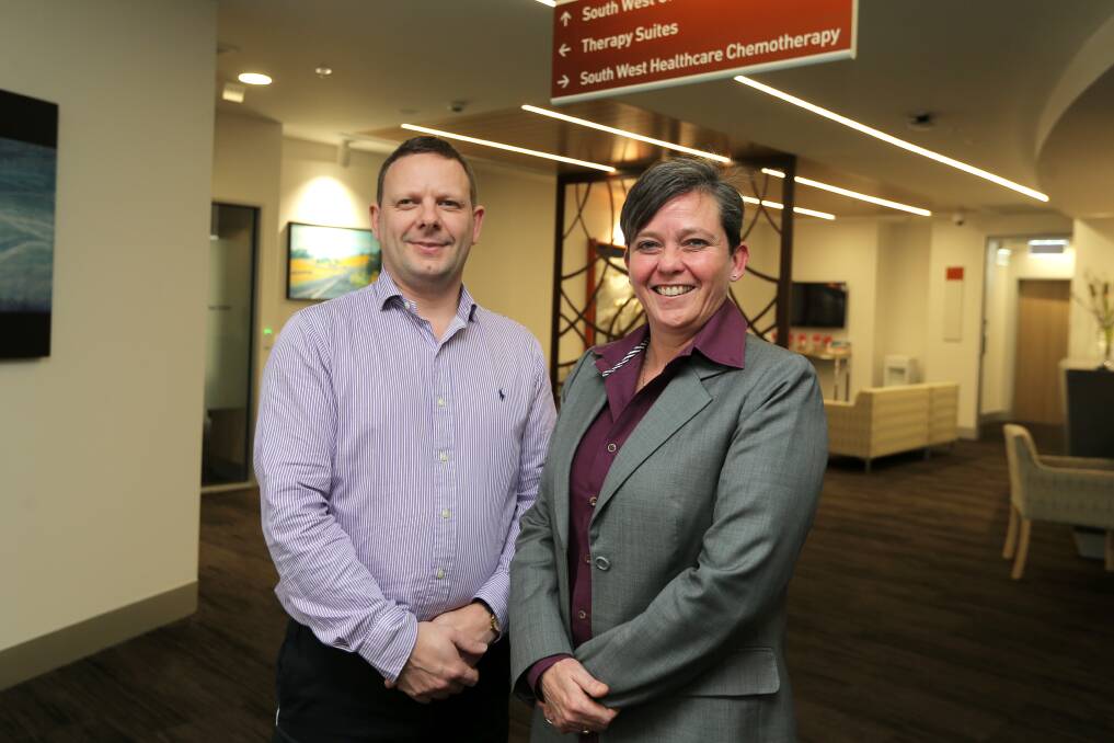 On the map: South West Oncology associate Professor Ian Collins and medical oncologist Terri Hayes at the new South West Regional Cancer Centre. Having an integrated cancer centre has raised the city's profile with Warrnambool selected to participate in an international clinical trial. Picture: Rob Gunstone
