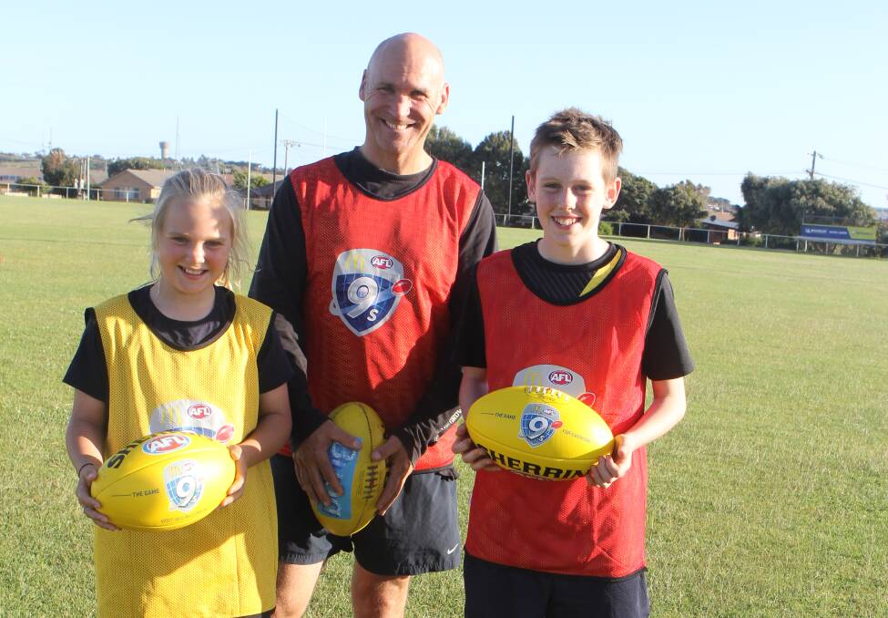 Ready: Warrnambool's Ziggy Wright, 10, Darren Wright and Miles Picken, 12, are looking forward to the AFL 9s competition. Picture: Madeleine McNeil