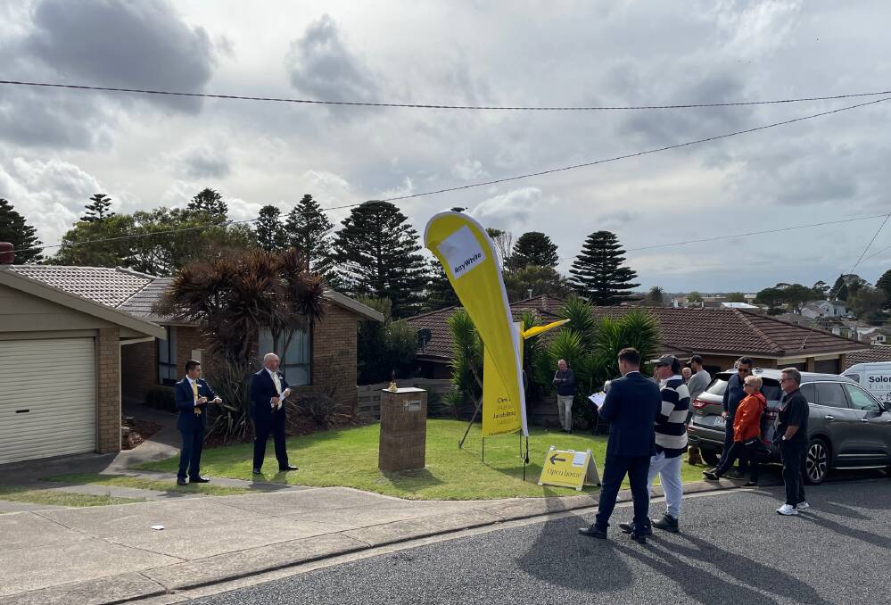 Sold: Ray White Warrnambool's Jacob Broughton and auctioneer Jason Thwaites conduct the sale of 19 Panorama Avenue on Saturday. It sold for $615,000.