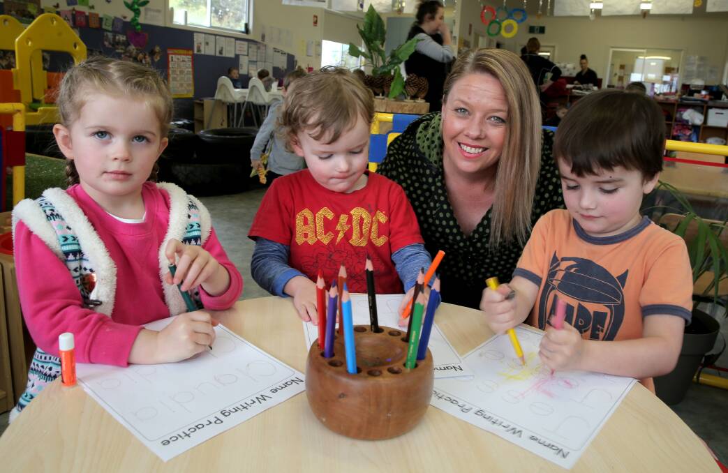 Choice: Honeypot Child Care Centre's Claudia Wiliams, 3, Joel Prentice, 3, and Jesse Prentice, 4, start prepare to transition to kindergarten with co-owner and kindergarten teacher Rebbecca Perry. Picture: Rob Gunstone