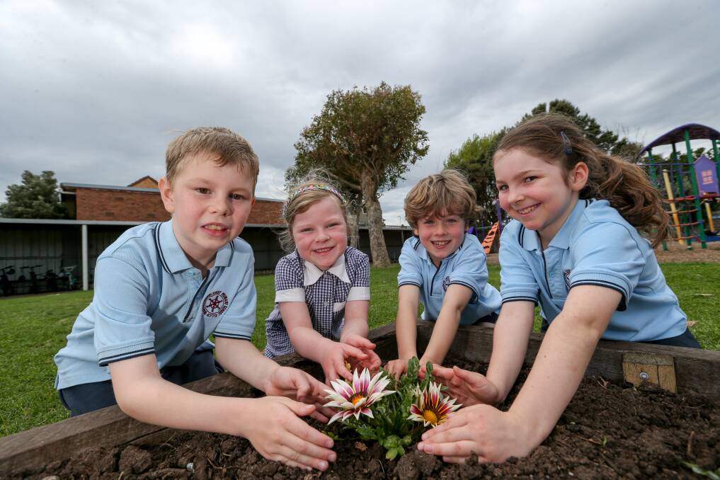 Ready to learn: Warrnambool East Primary School year one and two students Zeke Austin, Leah Boote, Sandro Clingan and Luka Price welcome the first day of term four on Monday. Picture: Michael Chambers