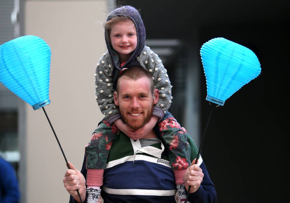 All lit up: Koroit's Jack Marney and Eden Farnes, 4, carry blue lanterns to show their support and raise awareness of the Leukaemia Foundation. Picture: Amy Paton