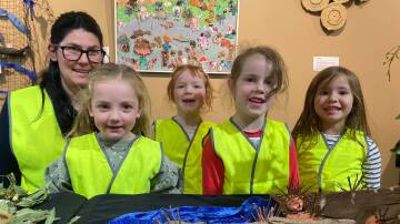 Artists: Florence Collins Kindergarten team leader Amber McFadyn and children Sophie O'Keeffe, 4, Evie Colgate, 5, Aurora Chamers-Simpson, 5, Deja, Brigham, 4, at the Indigenous art and language exhibition at the Lighthouse Theatre. Picture: Madeleine McNeil