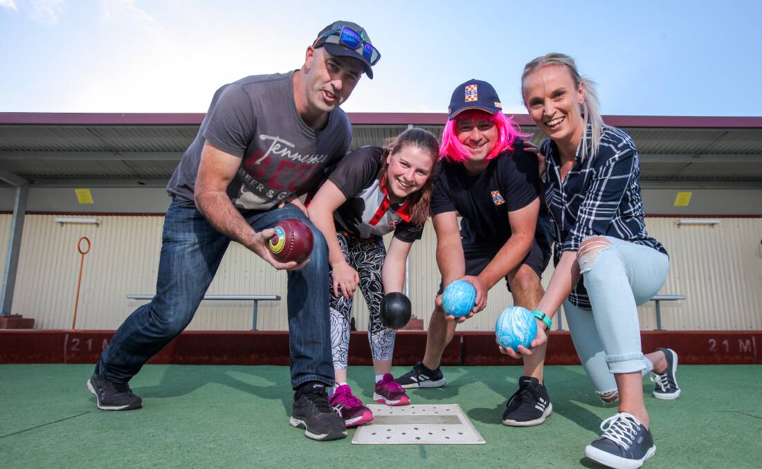 Bowled over: Mark Phillips, from Victoria Police Hamilton, CFA volunteer Edith Smith, Warrnambool SES unit controller Giorgio Palmeri and Rhi Davis from Ambulance Victoria Hamilton fight for space on the mat during the first Emergency Services Bowls Challenge Shield on Wednesday. Picture: Rob Gunstone