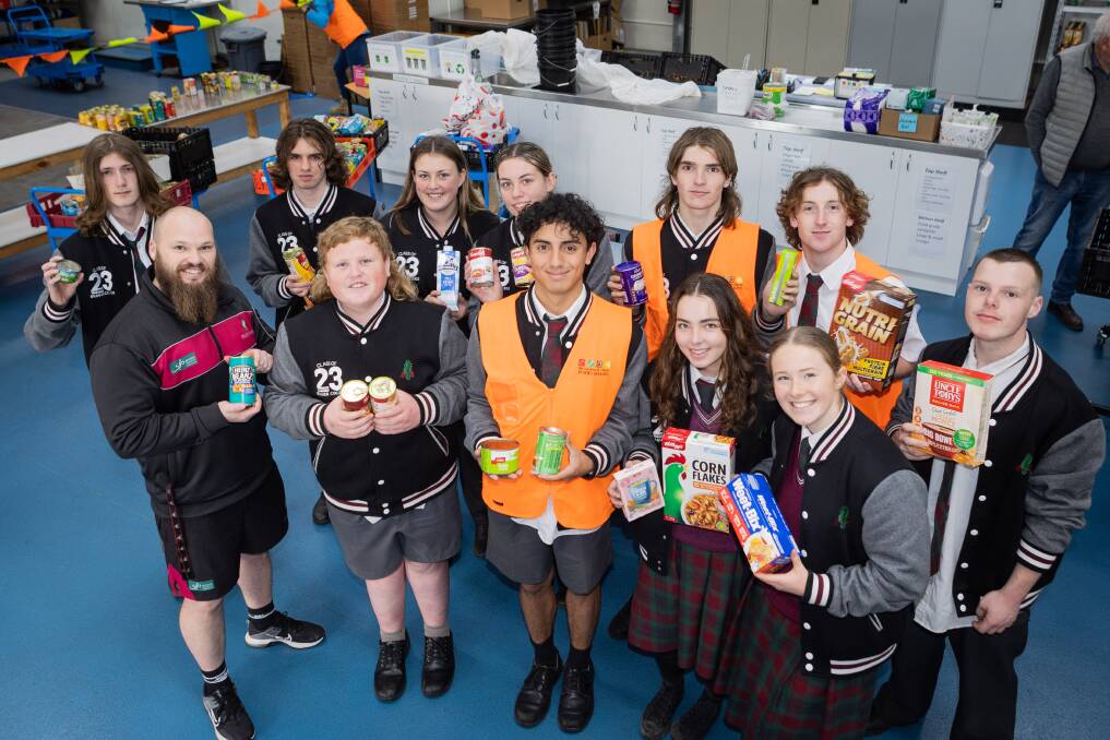 Brauer College VCE Vocational Major year 12 students with some of the 483 kilograms of donated food they collected to help Warrnambool and District Foodshare. Picture by Anthony Brady