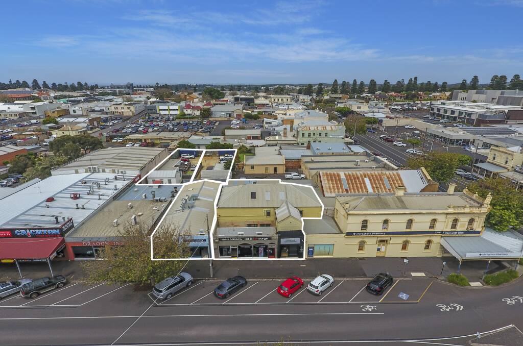 Central: A row of four commercial premises and two residences has sold for around $1.5million. Two separate cottages at the rear of the premises in McKean Lane will be auctioned online on Thursday. 