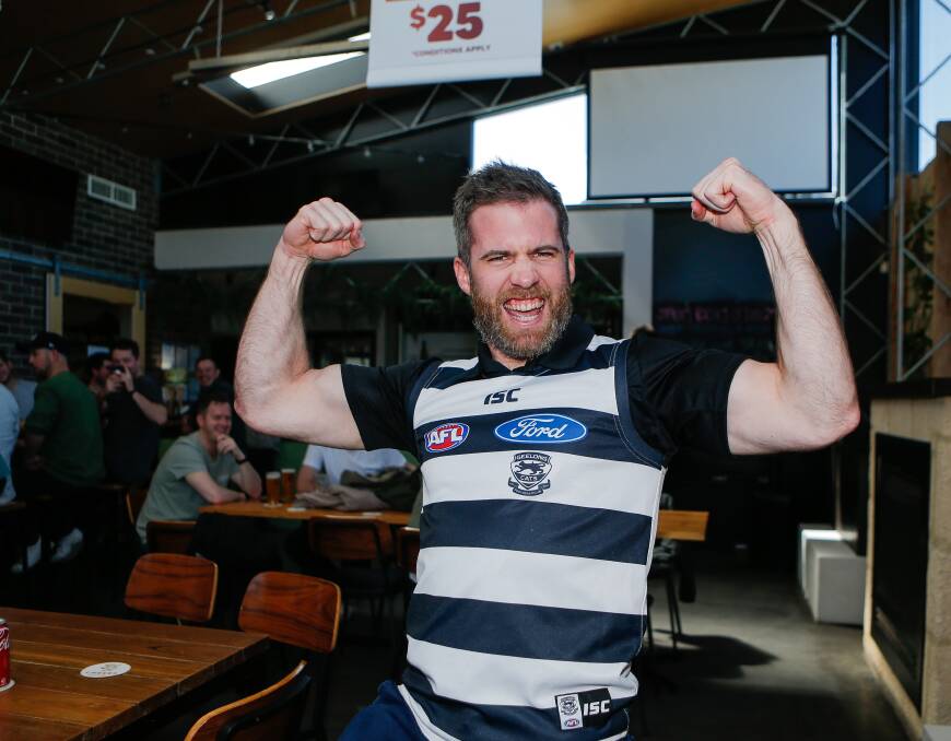 Cats supporter Brad Pattison celebrates a Geelong premiership on Saturday. Picture by Anthony Brady