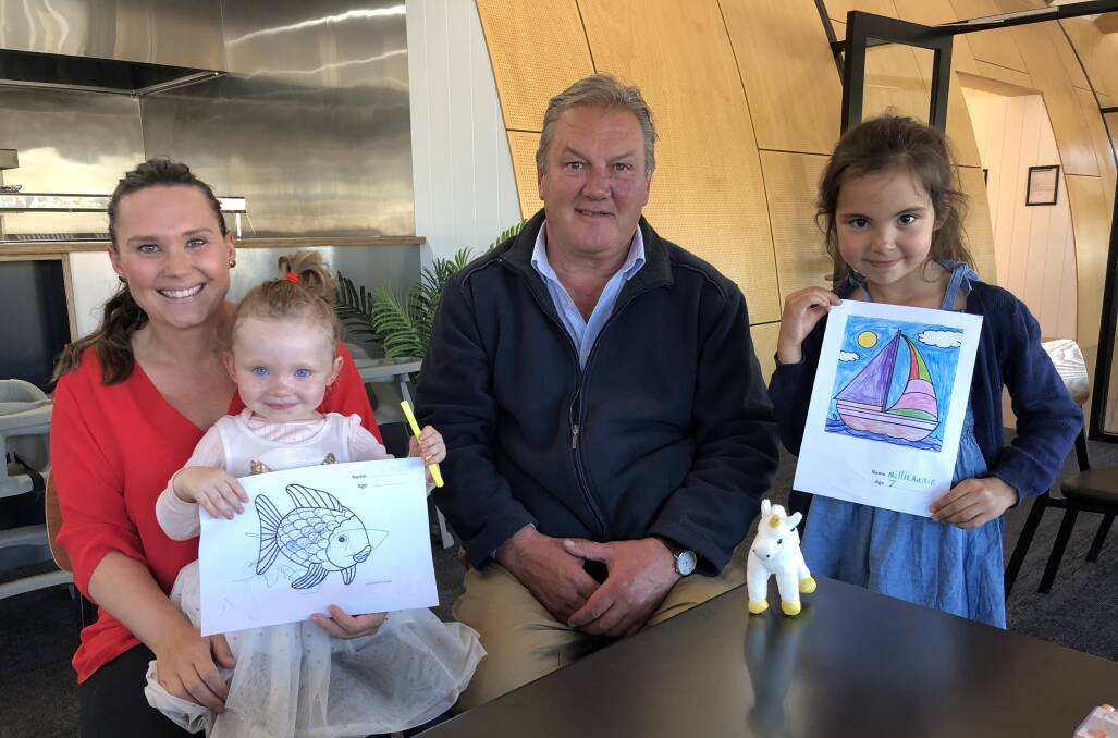 Bright: Colouring competition winners Elise Ploenges and daughter Thea, 3 and Millie Austin, 7, with Moyne Shire mayor Mick Wolfe and their competition entries.