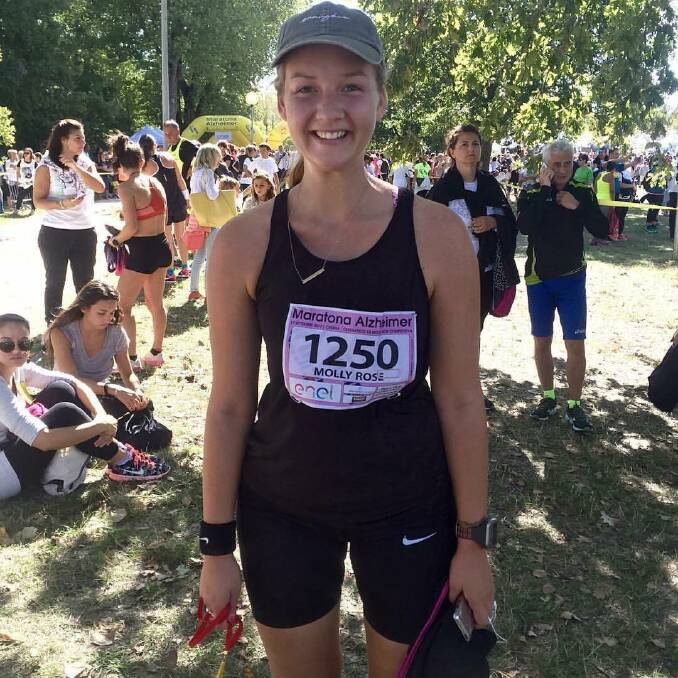 Fun: Molly Smith ran in a 16 kilometre event in Cesenatico in Italy last year. She will run in next weekend's Great Ocean Road half marathon to raise 
money for mental health awareness. 