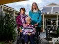 Failing: Family members and carers Faye Smith and Lois Radley are upset Thelma Milne, 97, had to wait more than three hours for an ambulance. Picture: Chris Doheny