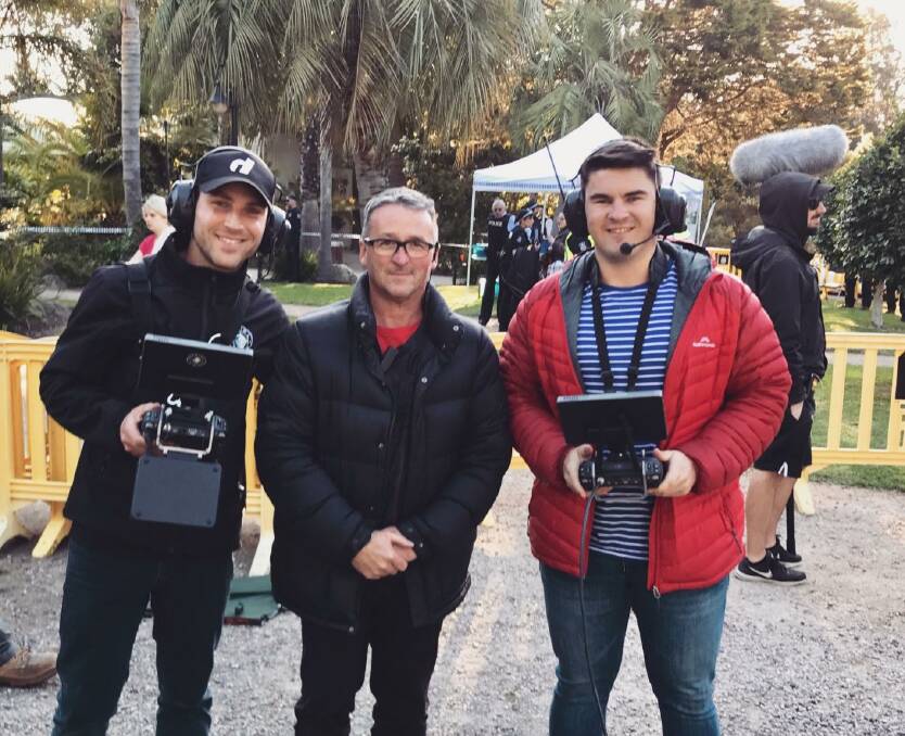 Film crew: Aerial Vision Services Justin Zattelman (left) and James Kol, of Warrnambool, (right) with Neighbours director of photography Steve Scoble. James spent a day on set as a drone camera operator last week capturing overhead images for the Australian television program.