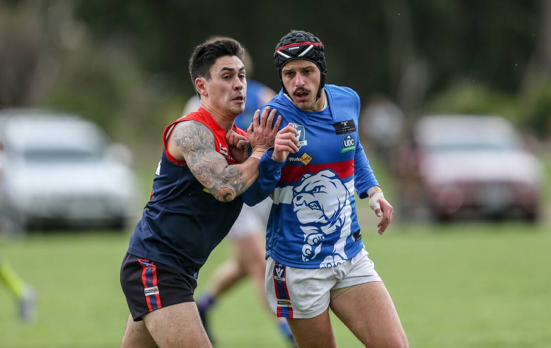 GAME ON: Timboon Demons' Lyndon Alsop and Panmure's Louis Kew jostling for position in their opening WDFNL match on Saturday. Picture: Christine Ansorge

