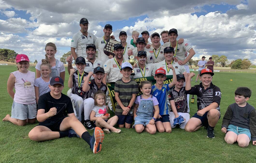 FAMILY FOCUS: West Warrnambool's division two premiership players welcome their "mascots" into the team shot. Picture: Justine McCullagh-Beasy 