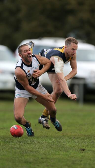CRUNCH: Warrnambool forward Travis Graham and North Warrnambool Eagles defender Brendan Murfett collide during their top of the table clash. Picture: Rob Gunstone