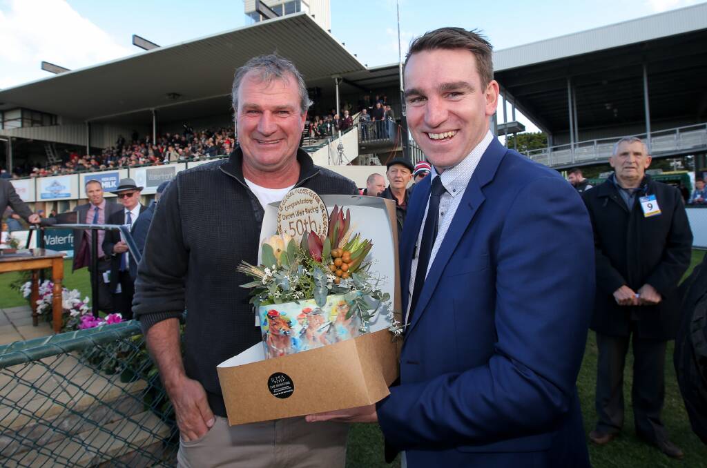 DOUBLE DELIGHT: Trainer Darren Weir was presented with a special cake from Warrnambool Racing Club chief executive officer Peter Downs after notching his 50th May Racing Carnival win. Picture: Rob Gunstone