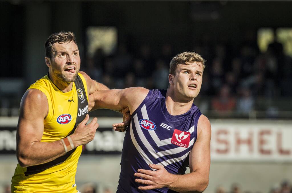 HEAVE HO: Fremantle ruckman Sean Darcy, pictured opposed to Richmond counterpart Toby Nankervis on Sunday, has accepted a one-game suspension. Picture: AAP
