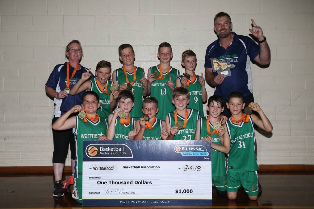 WINNERS ARE GRINNERS: Warrnambool Seahawks celebrate their victory at the Basketball Victoria Country under 12 championships.