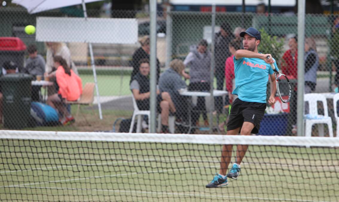 AGGRESSIVE: Geelong's Matt Hicks puts everything into a forehand in his win over ex-Warrnambool resident Oliver Good on Monday.  Picture: Sean Hardeman