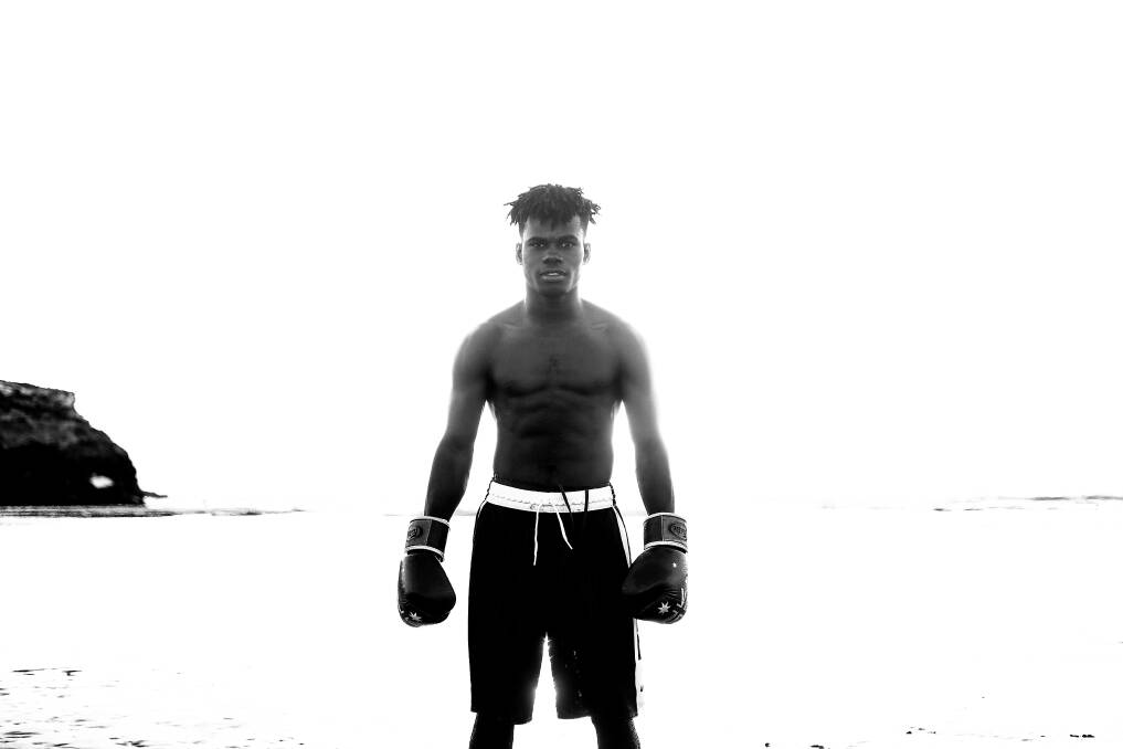 FIGHTING FIT: Kenyan refugee Brian Agina gets accustomed to the chilly Warrnambool beach. Picture: Morgan Hancock