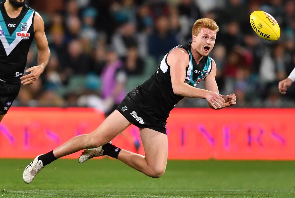 GAME ON: Port's Willem Drew will swap the Power strip for the Magpies' prison bar guernsey on SANFL grand final day. Picture: Getty Images
