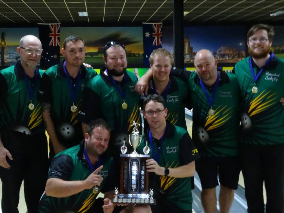 TEAM WORK: The victorious Warrnambool Tenpin Bowling Association team with the Victorian Country Cup trophy. 