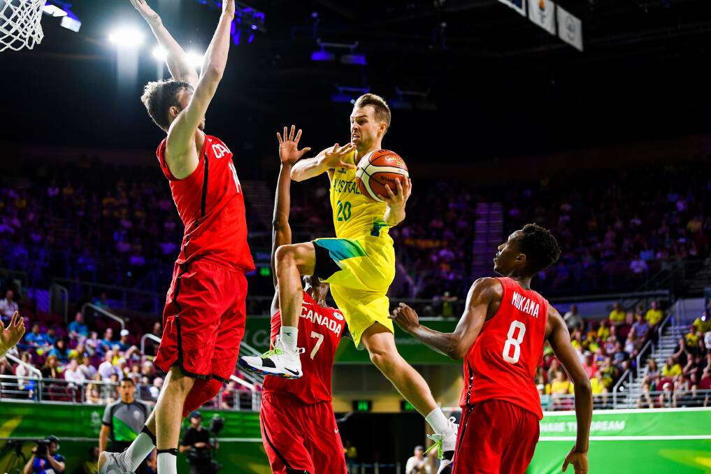 WATCH ME FLY: Australia's Nathan Sobey drives to the basket against Canada in the Commonwealth Games gold medal game.
