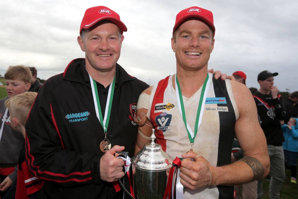 THREE ON THE TROT: Koroit coach Adam Dowie and captain Isaac Templeton with the premiership cup. Picture: Rob Gunstone