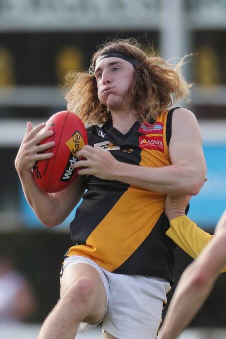 HAIR-RAISING FINISH: Portland's David Denboer takes a mark during the Tigers' one-point win over North Warrnambool Eagles on Saturday. Picture: Morgan Hancock